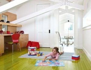 Above the great room, children can play undisturbed in a lofted space with a green-stained ash floor from LV Wood Floors. 