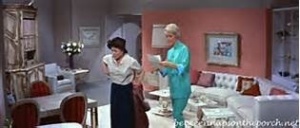 In this scene Doris is talking with her housekeeper in the living room. I would wear her pajamas. love the pink walls and  white furniture. I envisioned my grown up apartment to look like this, but as you know I love blue and white. 