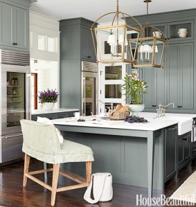 I think this one of the most beautiful kitchens published. Look closely and many shades of blue appear. the cabinets a blue gray, back splash tile a subtle blue-green and the it of brass make it shimmer.  Blue green mixtures have different meanings. A blue with more green like aqua conveys prestige, high ideals and attracts attention.  Turquoise, which has more blue than green suggests high powered and youthfulness. 